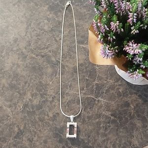 Silver necklace and charm